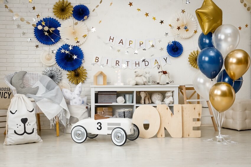 First birthday decorations with gifts, toys, and balloons