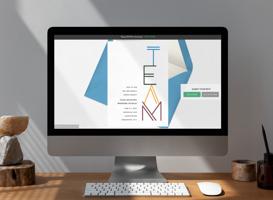 team building retreats: Computer monitor on a table with an open invitation showing on the screen