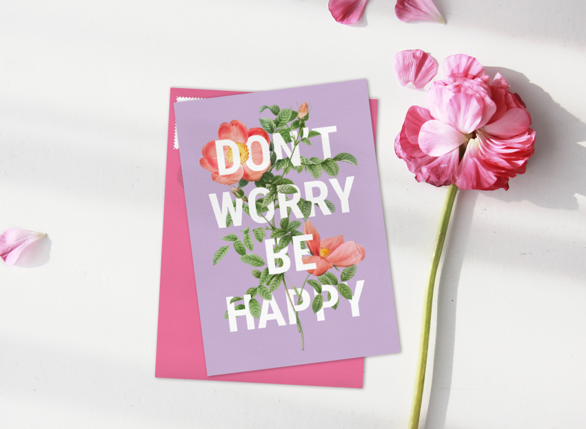 Just Because card featuring pink florals and bold typography that reads "Don't Worry Be Happy"